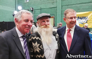 Fianna F&aacute;il TD &Eacute;amon &Oacute; Cu&iacute;v with supporters at the Galway West Election 2020 count on Monday.