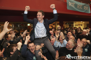 On the up: Alan Dillon is lifted high by supporters following his election. Photo: Michael Donnelly