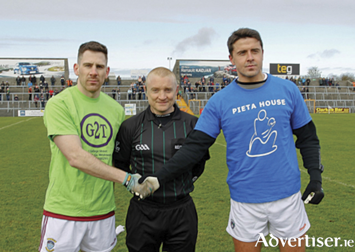 Garrycastle clubman and Westmeath senor football captain, James Dolan, both don messages of support for Pieta House prior to the start of their Allianz National Football League Division 2 fixture in TEG cusack Park, Mullingar, on Sunday.  Also pictured is match referee, Barry Cassidy.  Photograph by AC Sports Images.
