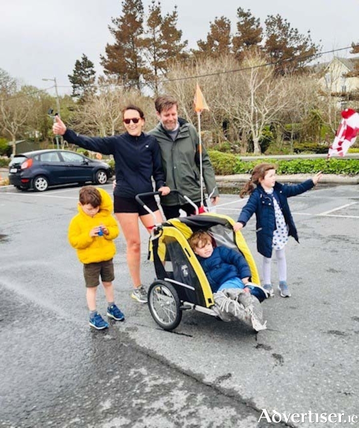 Lynne O Loughlin with her family after completing her half marathon. Left to right: Harrison, Lynne, Alan, Jonah, and Kitty.