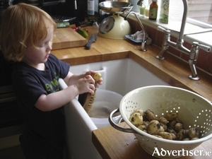 Giving the home grown spuds a wash.