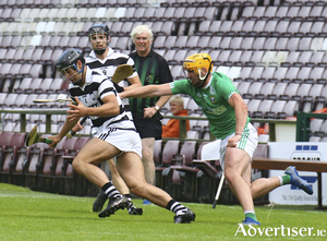 Daniel Loftus of Turloughmore and Kevin Lee of Liam Mellows in action from the Brooks Senior Club Hurling Championship clast at Pearse Stadium on Saturday. Photo:- Mike Shaughnessy