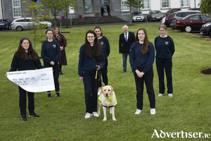 Colaiste Einde TY students Doireann Morrison, Sive Sampietro Daly, Anne Collins, (Teacher) Caoimhe O&rsquo;Sullivan, Hannah Baumann, Frank Downes, Irish Guide Dogs and Zander ambassador with Aoife Dirrane, Aylah Murphy handing over a donation to The Irish Guide Dogs Association to help with their work providing support dogs and Guide Dogs. TY students at Colaiste Einde recently held a virtual dog show, so contestants paid an entry fee of &euro;3 to enter their dogs. There were 12 different categories with prizes donated from a few local pet shops and grooming places. All proceeds went to the Irish Guide Dogs for the Blind.