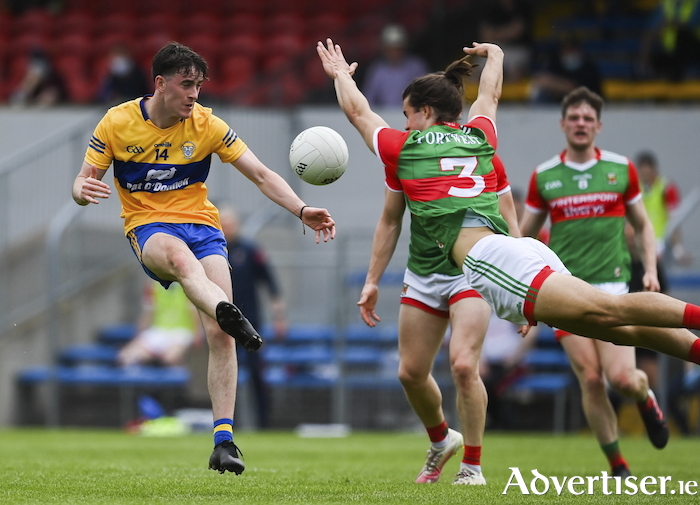Flying in: Oisin Mullin blocks down a shot from Joe McGann in Mayo's game against Clare. Photo: Sportsfile. 