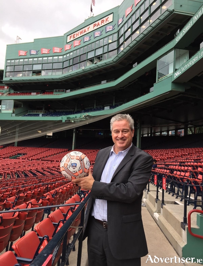 David Snow pictured with a Galway United football at Boston's iconic Fenway Park.