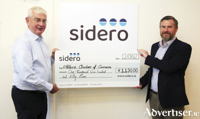 Wayne Byrne, Chief Commercial Officer, Sidero, makes a cheque presentation towards the Athlone India Covid-19 appeal to Athlone Chamber of Commerce CEO, Gerry McInerney
