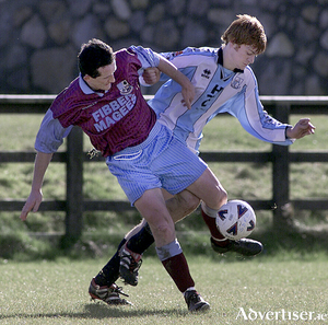Ollie Neary, Mervue United, and Brian Geraghty, Salthill Devon, tussle during a match in 2003.