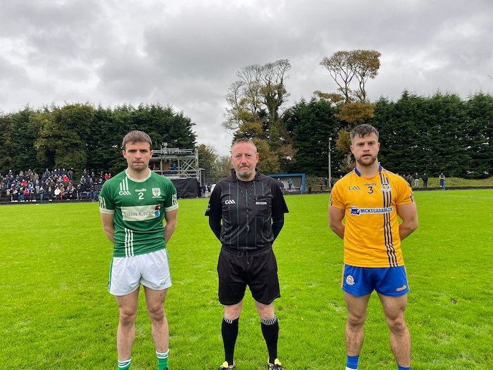 Ready to go: Charlestown captain Gerard McLoughlin and Knockmore captain David McHale with referee John Glavey ahead of throw-in on Saturday. Photo: Mayo GAA 