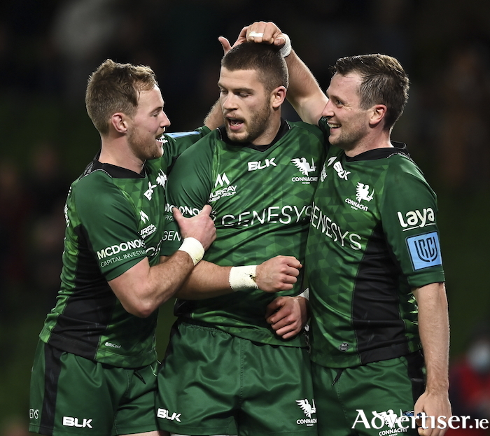 Try-scorer Diarmuid Kilgallen celebrates with Kieran Marmion  and Jack Carty during the United Rugby Championship match against Ulster at Aviva Stadium in Dublin. Photo:  Brendan Moran/Sportsfile