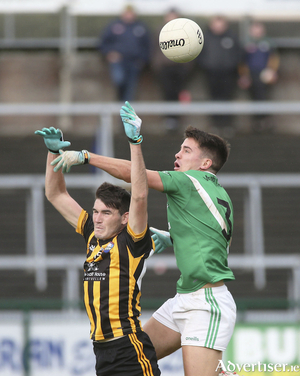 Moycullen&rsquo;s Sean &Oacute; Ceallaigh and Barry McHugh of Mountbellew Moylough contest possession in the 2021 Galway Senior Football Championship semi-final at Pearse Stadium.
