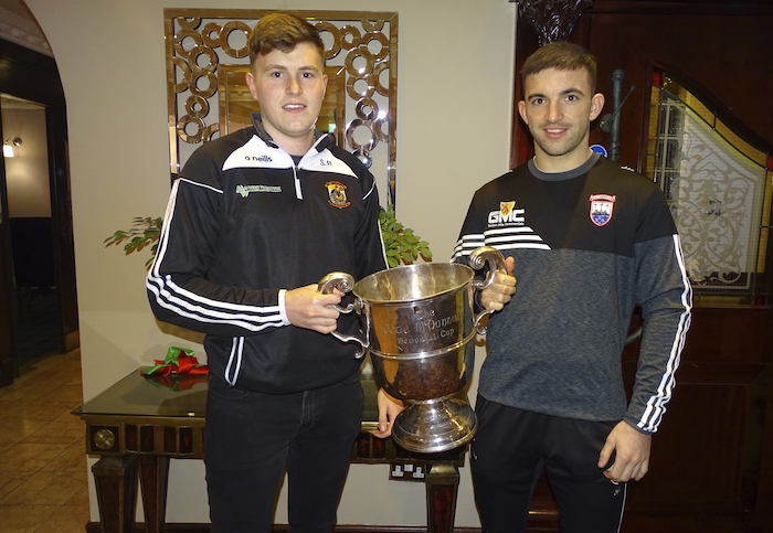 Hands on the cup: Kilmeena and Cill Chomáin will battle it out to be TF Royal Hotel Mayo GAA Junior Champions on Saturday. Photo: Mayo GAA