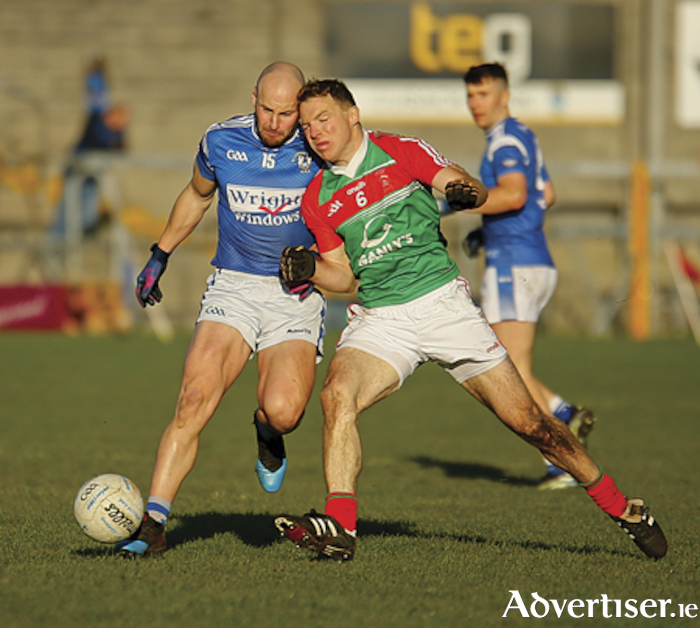 Garrycastle playing stalwart, John Gaffey, arguably his club’s best performer in the replayed Westmeath senior football championship final, challenges Peter Foy of St Lomans for possession in TEG Cusack Park.  Photograph by AC Sports Images.