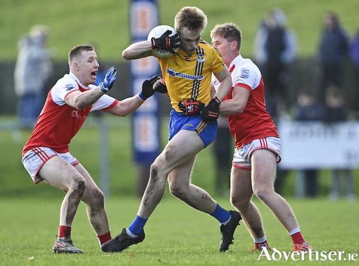King amongst men: Kieran King in action against Ryan O'Donoghue and Marty Boylan during the Mayo County Senior Club Football Championship Final match between Knockmore and Belmullet. Photo: Sportsfile. 