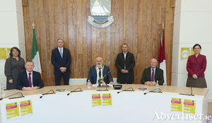 Pictured at &Aacute;ras an Chontae for the contract signing of the N59 Moycullen Bypass were  (seated) Cathaoirleach Peter Keaveney, Jim Cullen (left) Chief Executive and Charles Wills of Wills Brothers Contractors. Cllr Eileen Mannion, Senator Sean Kyne, Cllr Noel Thomas and Minister of State Hildegarde Naughton.Photo:- Mike Shaughnessy