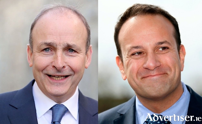 A changing of the guard? The outgoing Taoiseach, Micheál Martin, and the returning one, Leo Varadkar.