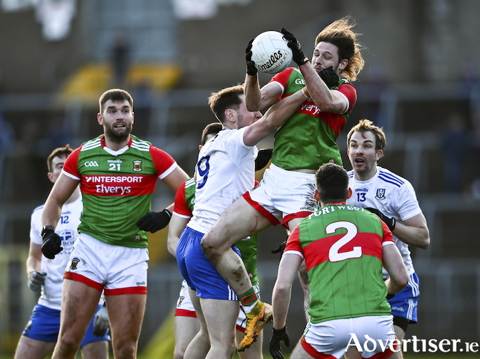 Up and at it: Padraig O'Hora battles for the ball in the air against Monaghan. Photo: Sportsfile 