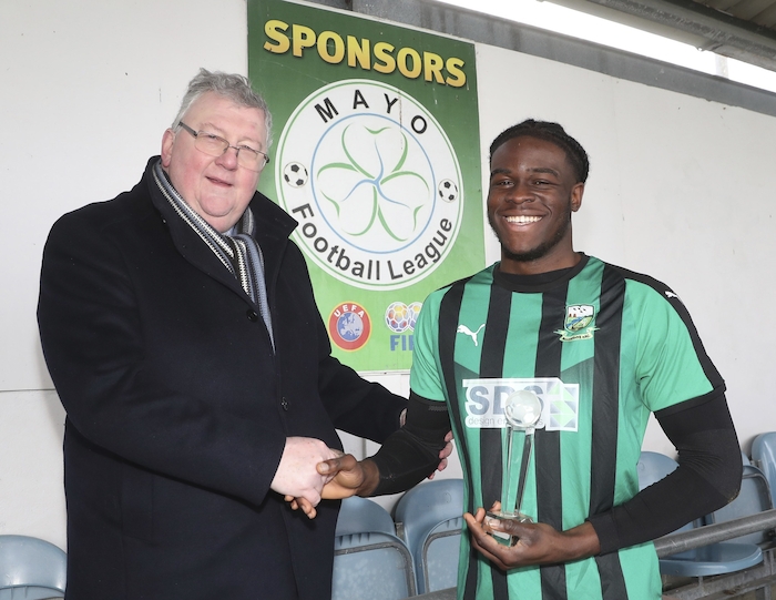 Key man: Pat Jennings of the TF Royal Hotel and Theatre presents the Player of the Match award to Ben Edeh in the TF Royal Hotel and Theatre U-21 Division 1 Final in Solar 21 Park Castlebar. Photo: Michael Donnelly