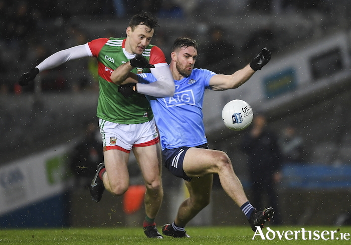 No holding back: Diarmuid O'Connor battles for the ball against Sean MacMahon in Croke Park last Saturday night. Photo: Sportsfile.
