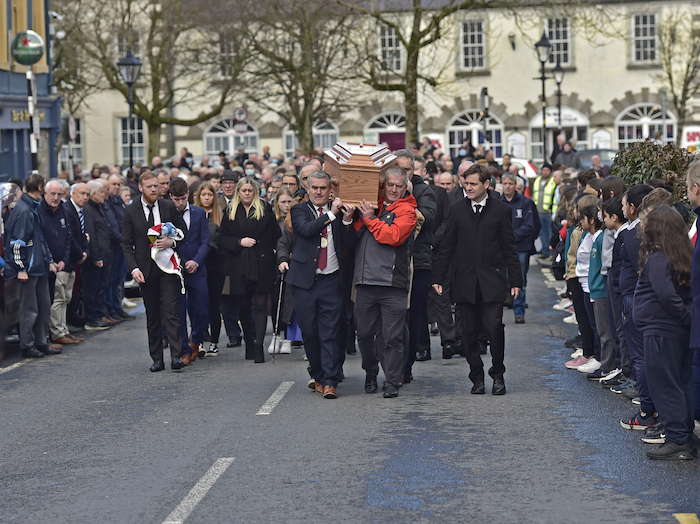 The remains of Martin Keane are carried by current and former representatives of West Mayo Municipal District as the cortege made its way up Bridge St Westport on its way to Drummin graveyard for burial Monday afternoon. Photo:  Conor McKeown