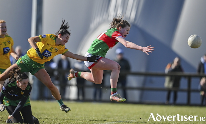 Sinead Walsh of Mayo scores her side's first goal despite the efforts of Shelly Twohig of Donegal, left, and Donegal goalkeeper Roisin McCafferty during the Lidl Ladies Football National League Division Division 1A, Round 3 match between Mayo and Donegal at Connacht GAA Centre of Excellence in Bekan, Mayo. Photo: Sam Barnes/Sportsfile 