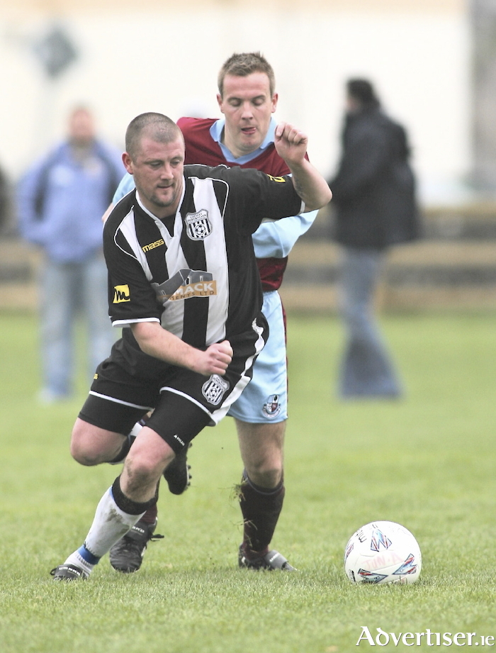 Ger McGrath in action for Mervue United against Galway Hibernians' Tony Folan in 2006. Photo:-Mike Shaughnessy
