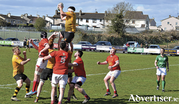 Ruairi Byrne leaps highest to win this lineout for Buccaneers at Cashel.