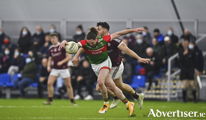 From indoor to outdoor: Padraig O'Hora looks to get away from Damien Comer during the last meeting of the sides which took place under the roof of the NUIG Connacht GAA AirDome in January. Photo: Sportsfile. 