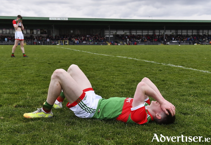 The pain of defeat: Sean Morahan of Mayo lies dejected after his side's defeat in the EirGrid Connacht GAA Football Under 20 Championship Final match between Mayo and Sligo at Markievicz Park in Sligo. Photo: Sportsfile.