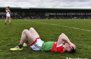 The pain of defeat: Sean Morahan of Mayo lies dejected after his side&#039;s defeat in the EirGrid Connacht GAA Football Under 20 Championship Final match between Mayo and Sligo at Markievicz Park in Sligo. Photo: Sportsfile.