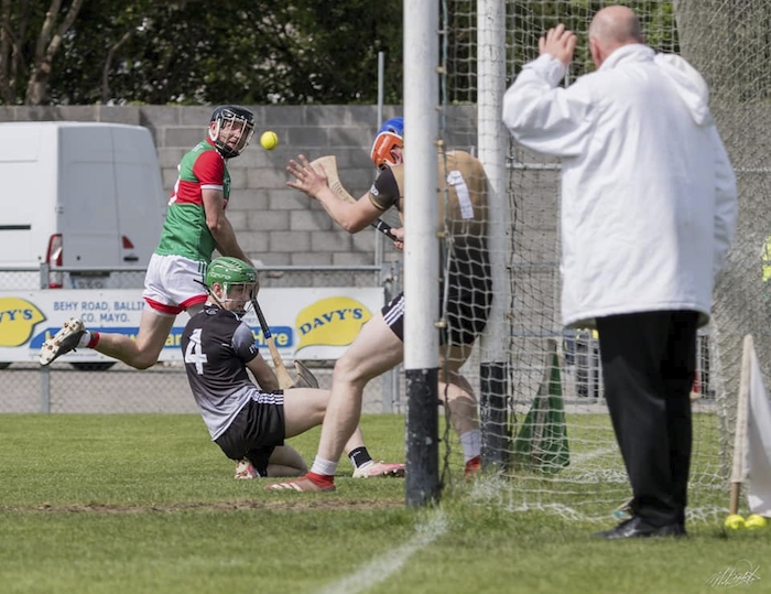 Eyes on the prize: Keith Higgins watches as his effort heads for the back of the Sligo net. Photo: Mayo GAA 