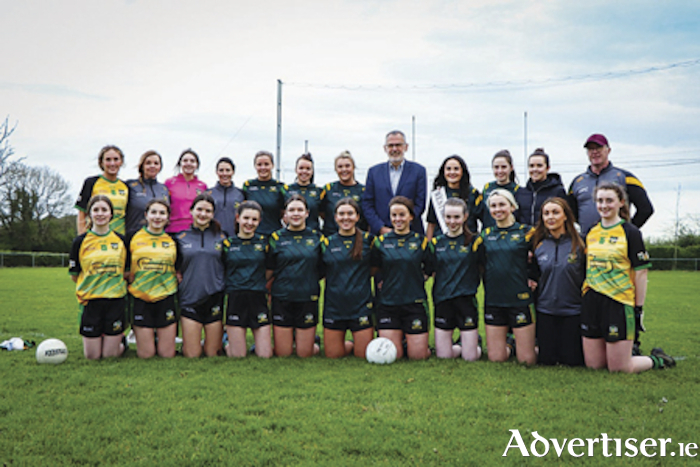 GAA president, Larry McCarthy, takes time out for a picture with the Cill Oige ladies playing squad and management during his recent visit to Rosemount GAA club where he opened the new gym facility
