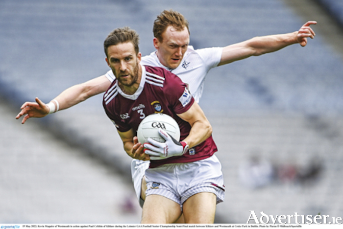 Caulry club player and Westmeath captain, Kevin Maguire, wins possession ahead of Paul Cribbin of Kildare during the Leinster senior football championship semi-final contest at Croke Park. Photo by Piaras O'Midheach/Sportsfile.