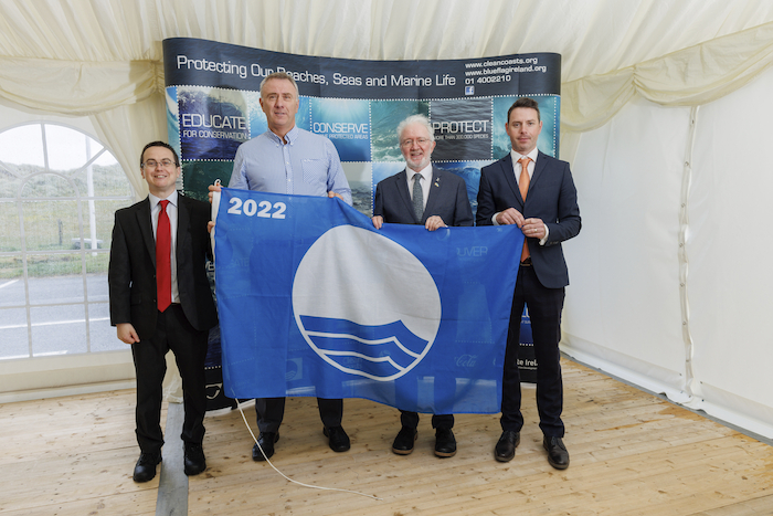Blue Flags At the Blue Flag ceremony:- pictured at the event are Ian Diamond (Coastal Awards Manager, Environmental Education Unit, An Taisce - The National Trust for Ireland),  Jim Horan (Mayo County Council), Malcom Noonan TD (Minister of State with responsibility for Heritage and Electoral Reform) and  Shane Dineen (Environment & Planning Manager  - Fáilte Ireland).