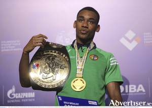 European middleweight champion Gabriel Dossen of Ireland, celebrates with his gold medal and belt.