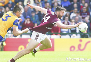 Galway&#039;s Damien Comer is held by Roscommon&#039;s Brian Stack in the Connacht GAA Football Senior Championship final in Pearse Stadium on Sunday. 
Photo:- Mike Shaughnessy