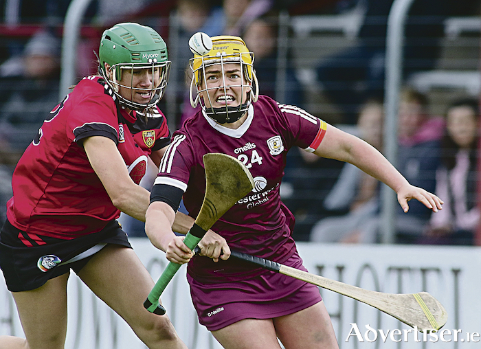 Galway's Siobhan McGrath is chased by Down's Caitriona Caldwell in action from 2022 Glen Dimplex All-Ireland Senior Camogie Championship, round 3 game at Kenny Park Athenry on Saturday. Photo:- Mike Shaughnessy 