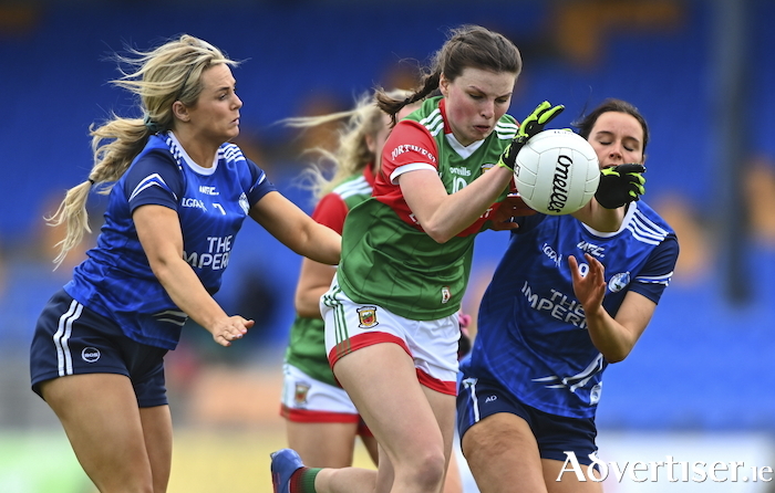 Aoife Geraghty of Mayo gets through the challenges of Mona Sheridan, left, and Annie Deneher of Cavan during the TG4 All-Ireland SFC Group A Round 2 match between Cavan and Mayo at Glennon Brothers Pearse Park in Longford. Photo by Ben McShane/Sportsfile