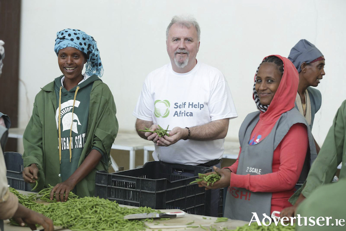 Ronan Scully of Self Help Africa with Yeabsira and Tigest women farmers and beneficiaries of Self Help Africa's work in Sodo in Ethiopia