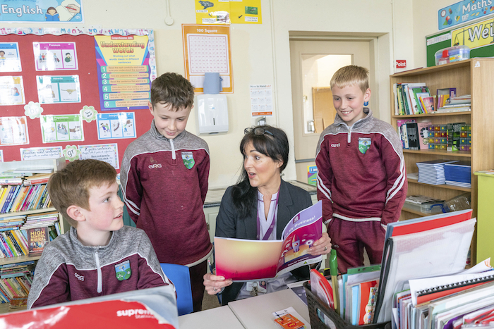 Future business leaders: Helen Quinn, AIB Castlebar with fourth class pupils Cian Lawless, Luke Butler and Aidan Judge who are taking part in the Junior Achievement Ireland ‘It’s My Business’ programme sponsored by AIB in Ballyvary National School, Co. Mayo. Photo : Keith Heneghan.