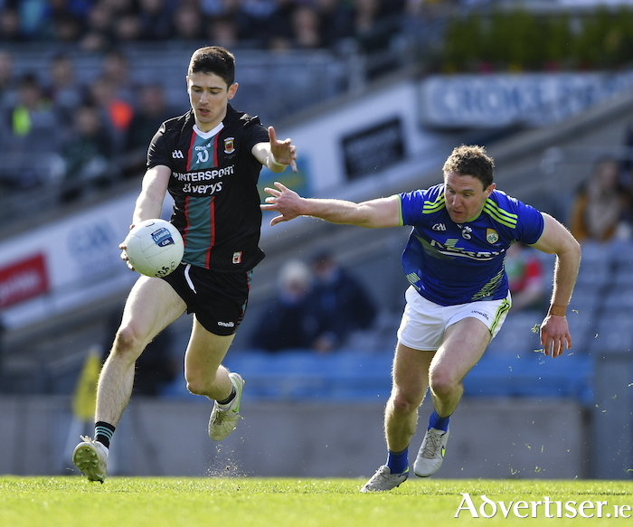 Back to black and blue: Conor Loftus looks to escape the clutches of Tadhg Morley in the league final meeting between Mayo and Kerry earlier this season. Photo: Sportsfile. 