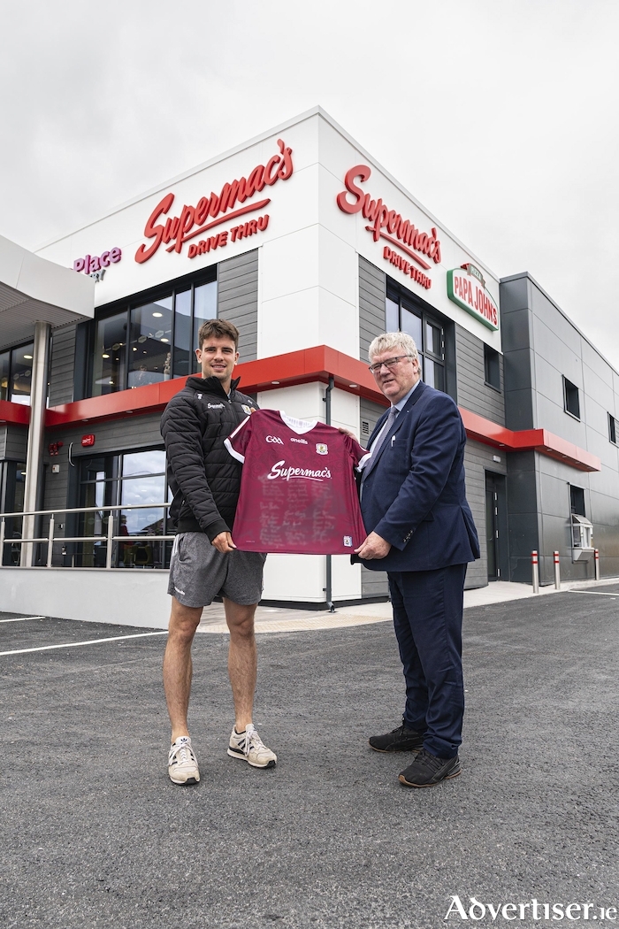 Galway football captain, Seán Kelly, presents a signed jersey to Galway GAA sponsor Pat McDonagh at the newly opened Loughrea Service Station.