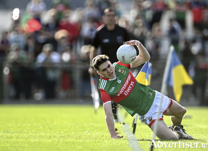 Sliding in: Jack Keane tries to keep the ball alive for Mayo. Photo: Sportsfile. 