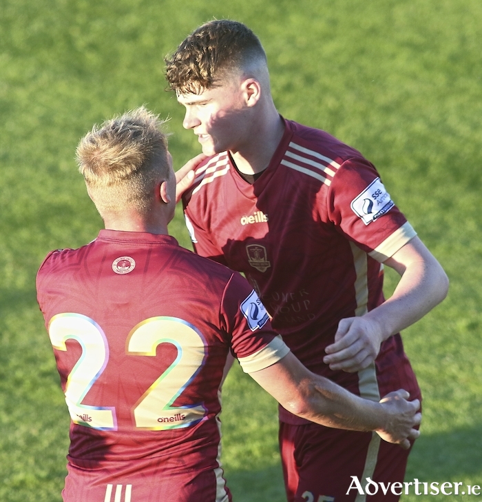 Alex Murphy is embraced by Galway United captain Conor McCormack. Photo:-Mike Shaughnessy.
