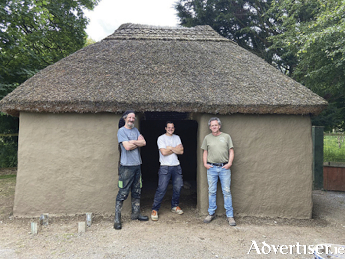 Visitors to Dún na Sí Heritage Park in Moate recently received an insight into the craft and skill of using earth and lime mortar when the replastering and repair of the replica Famine Bothan in the Park took place.
