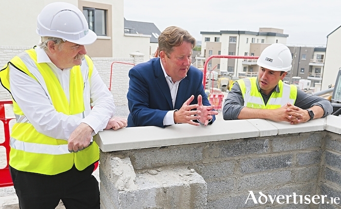 The Minister for Housing, Local Government and Heritage, Darragh O’Brien TD pictured with Finian Hanley (right) of MPH and Declan Dunne  CEO of Respond and Minister of State,  on a visit to Gaelcarrig, a social housing scheme off Circular Road on Tuesday morning. The 83-unit mix of houses and appartments is developed by MPH on behalf of Respond Housing Association and is being built by Monami Construction. It is due to be completed later this year. Photo:- Mike Shaughnessy
