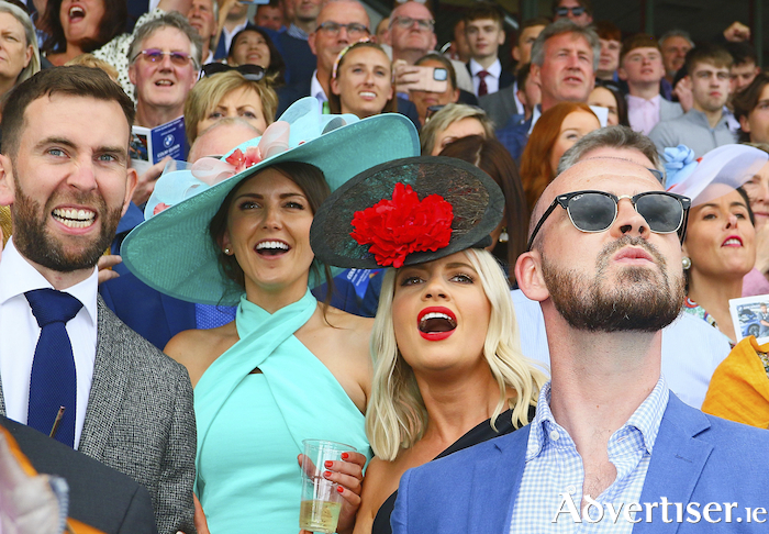 Anticipation - Rory Conway, Bronagh Crmpton, Emer Murphy and Darragh Byrne of Bearna watch the closing moments of a race at the Galway Races on Tuesday. Photo:- Mike Shaughnessy