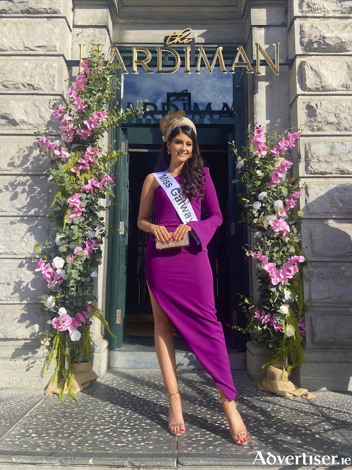 Miss Galway, Ava Matthews pictured at The Hardiman A Legacy of Style event on Ladies Day. She is wearing a purple dress from Harper Boutique Galway and gold headpiece from Crevation designs. 
