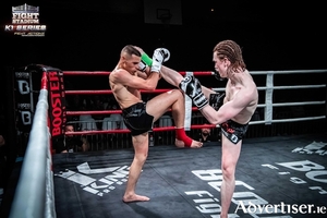 Cian McCormack (right), his most recent fight in France where he won an International four man K-1 tournament, can now prepare for a world title.