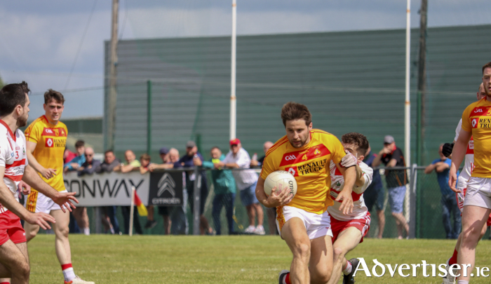 Driving out: Donal Newcombe on the break for Castlebar Mitchels against Aghamore last weekend. Photo: James Killeen. 