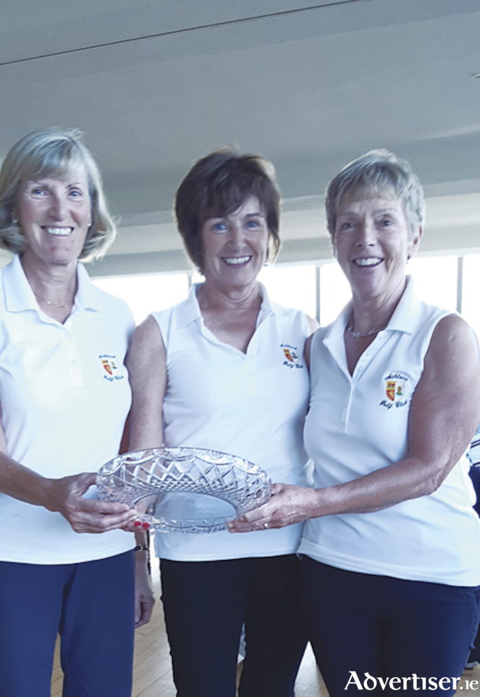 Imelda Sheeran, Chris Fuery and Kay Delaney, are pictured accepting their team trophy after winning the final of the Senior Ladies Golfing Society which took place recently at Athlone Golf Club